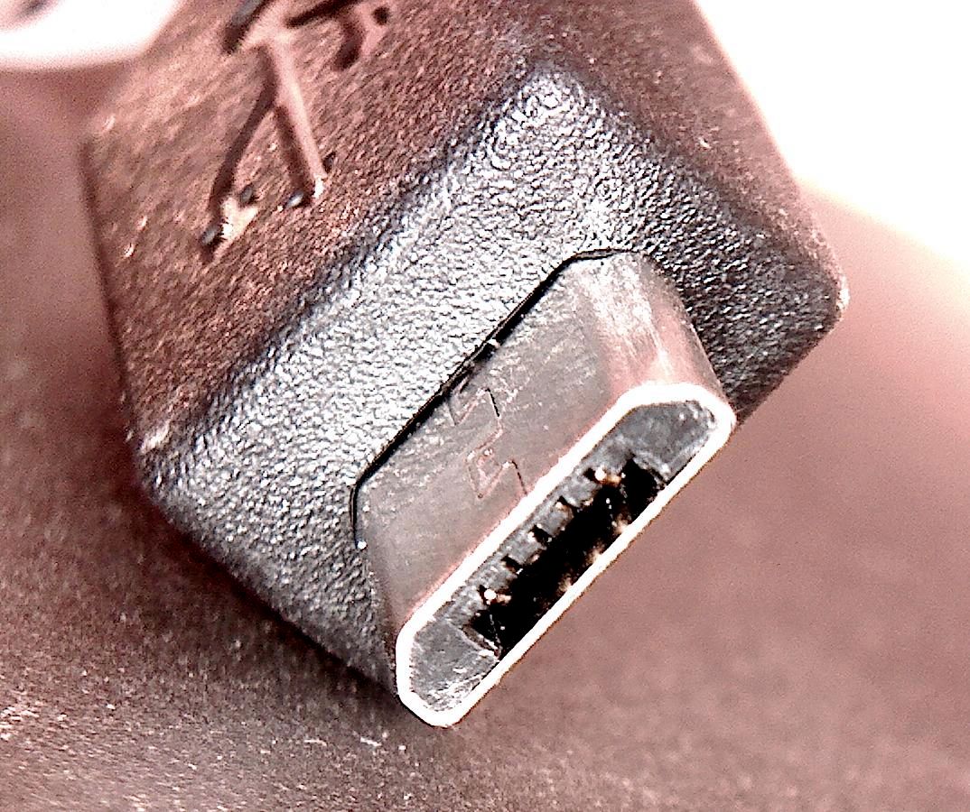 Single Micro-USB plug with its asymmetric connector face visible